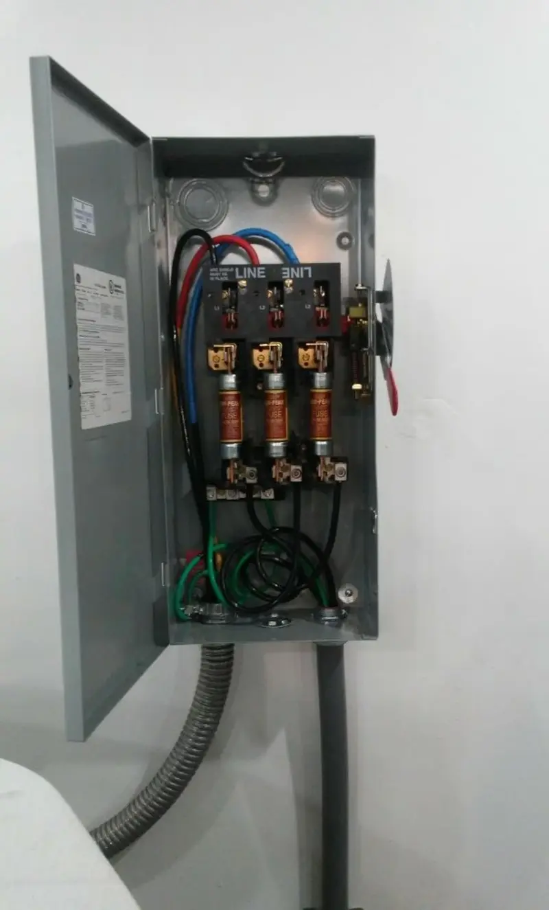Three-phase disconnect switch installed for Smoke Detector Installation in Liberty Triangle