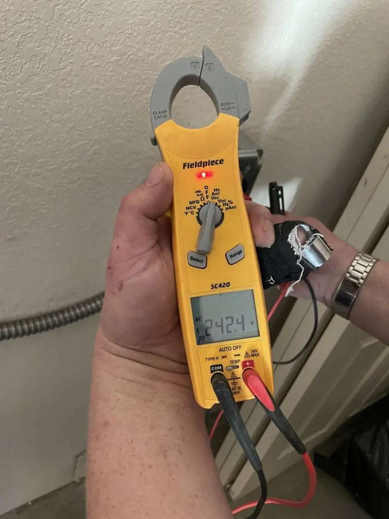 Voltage testing with clamp meter during Electrical Installation Services in Liberty Triangle